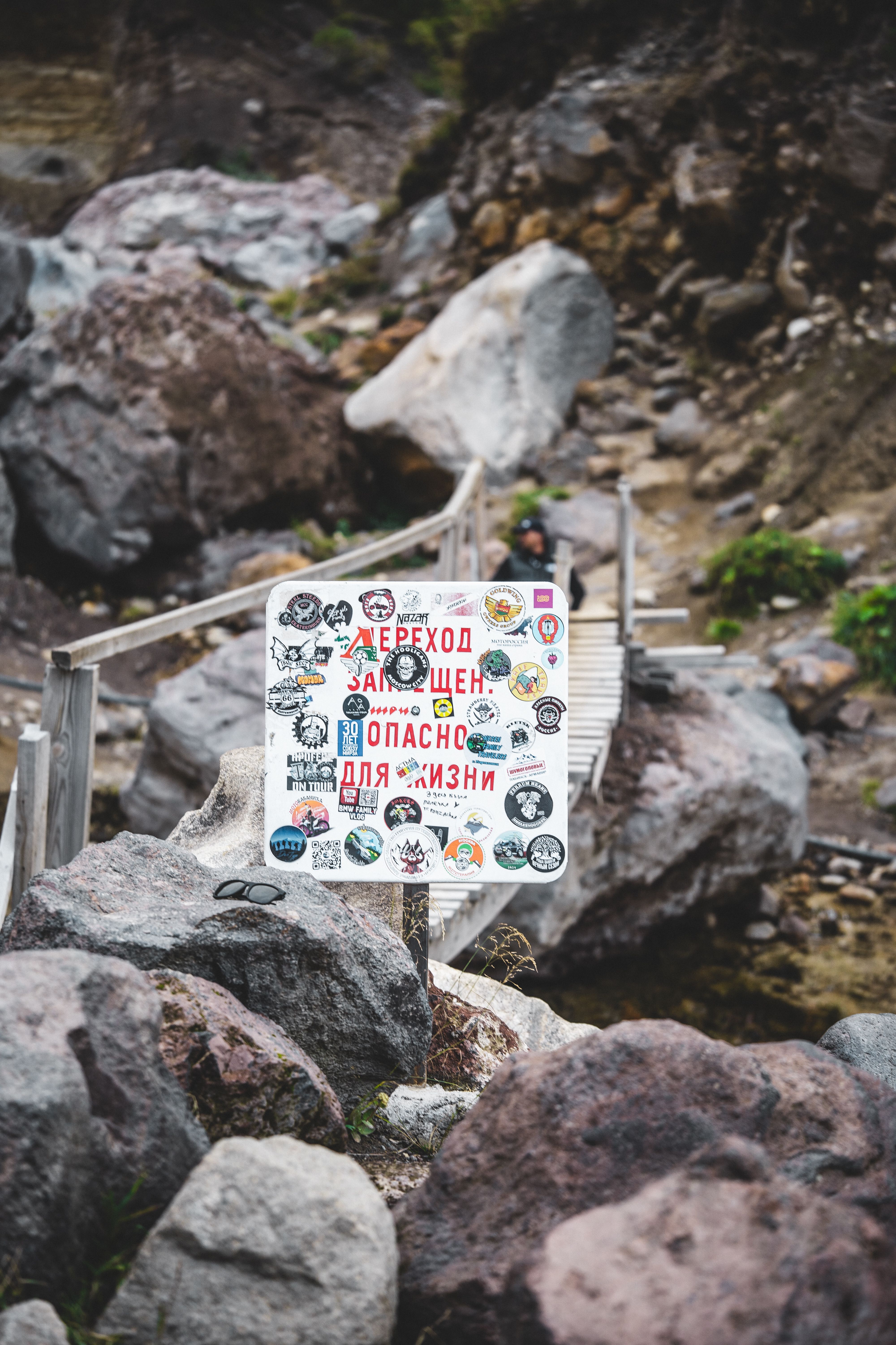 Dangerous Path Sign on Rocky Terrain · Free Stock Photo