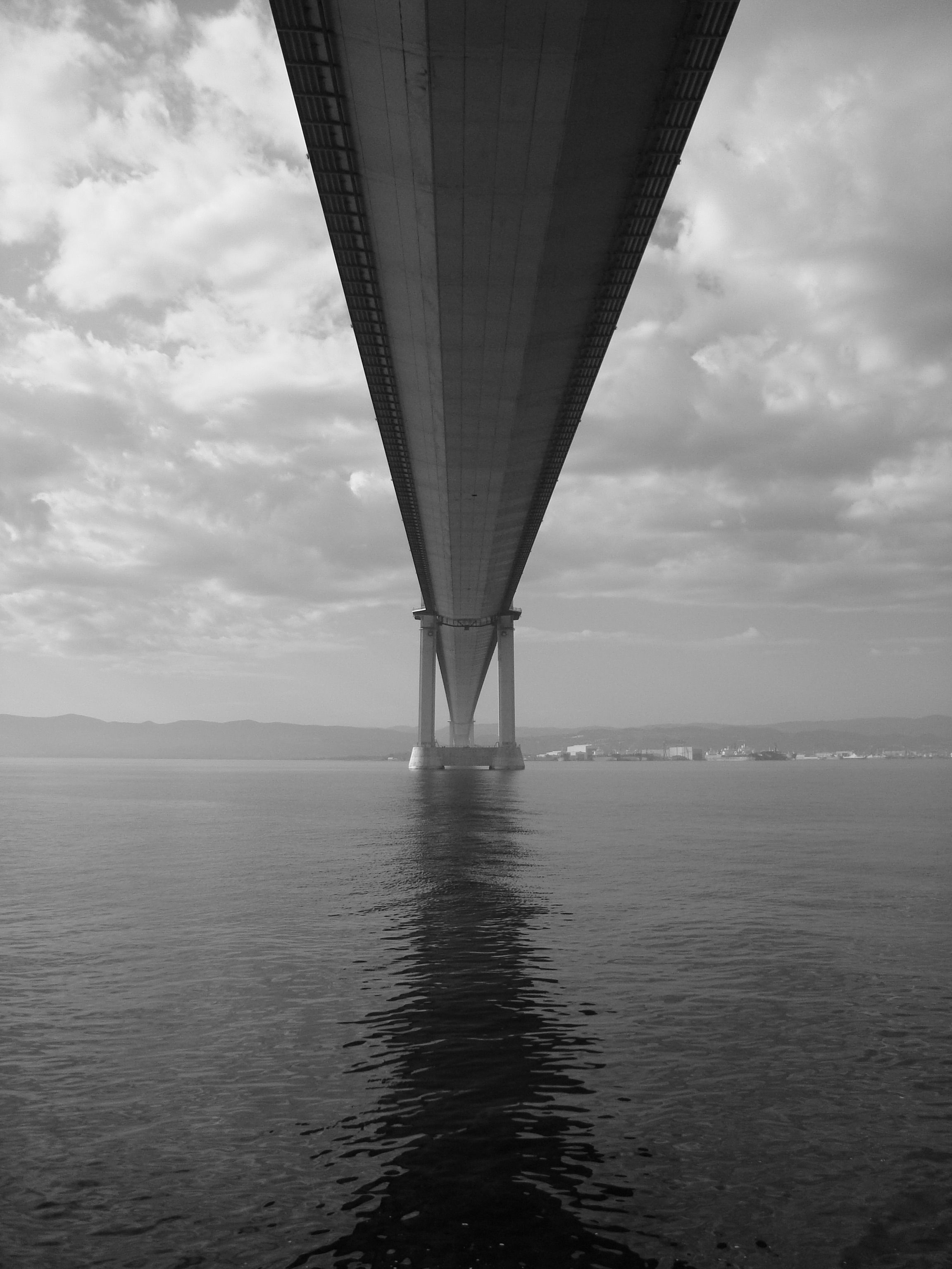 Black and White Bridge Over Water Perspective · Free Stock Photo