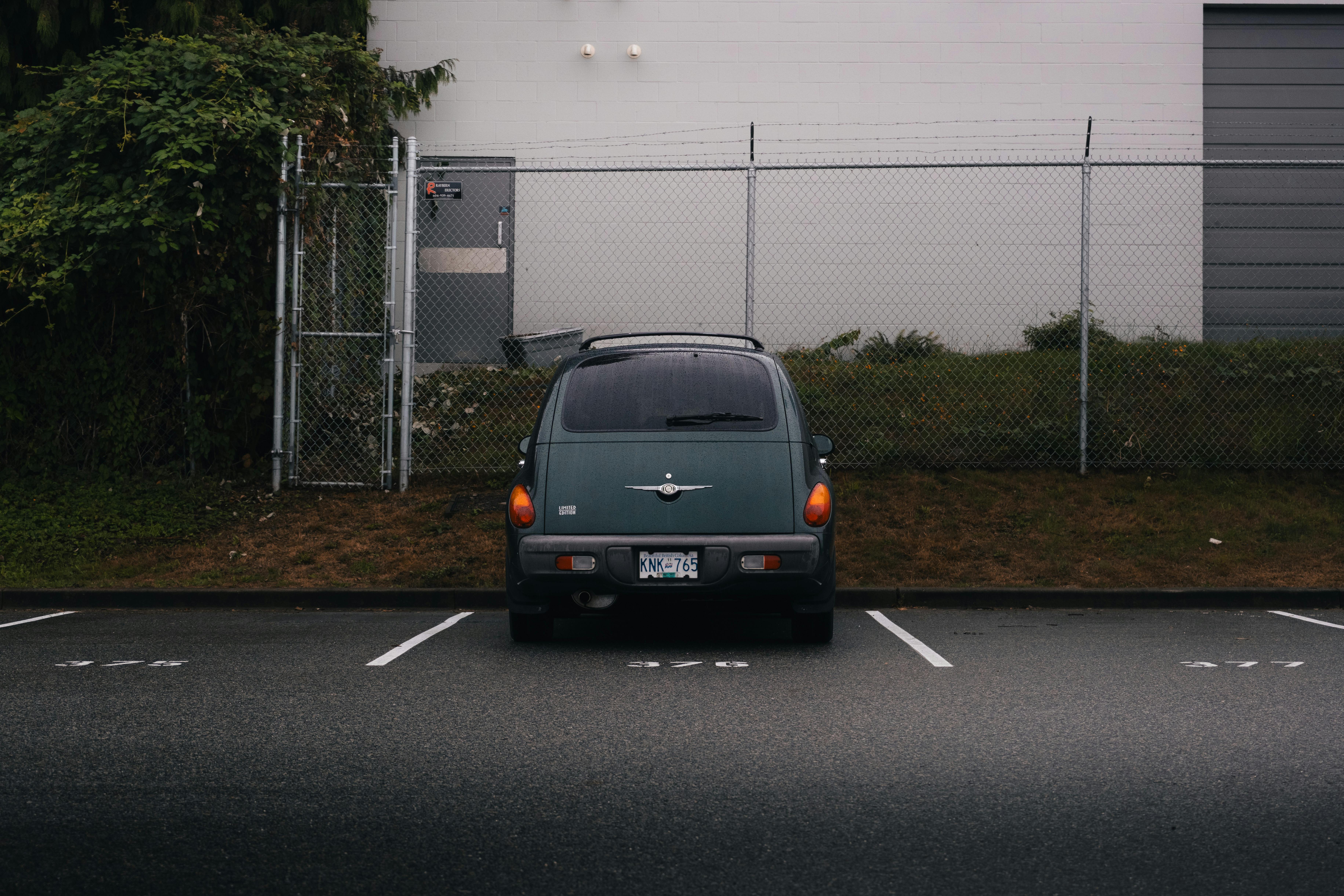 moody parking lot with green car in port moody