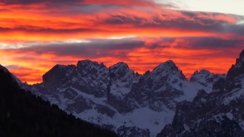 Free Breathtaking sunset in Canazei showcasing vibrant skies over Dolomites. Stock Photo