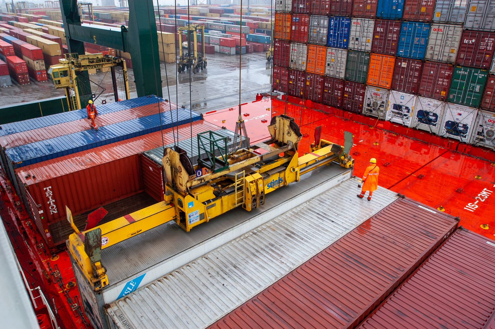 Worker on Duty: Checking the Container Loading · Free Stock Photo