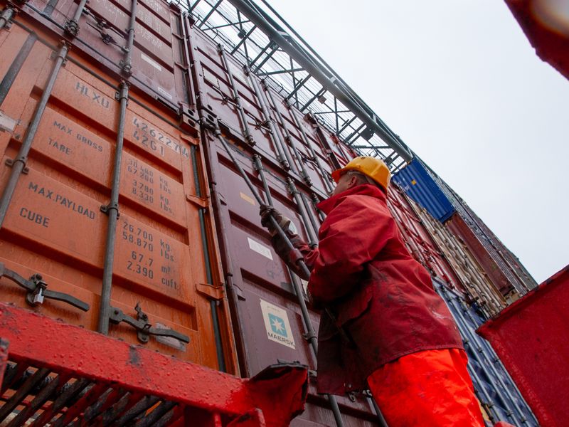 warehouse workers preparing urban delivery parcels at micro-fulfillment station