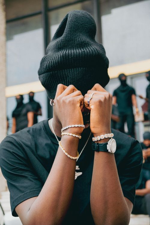 Free Stylish portrait featuring jewelry and street fashion. Urban vibe. Stock Photo