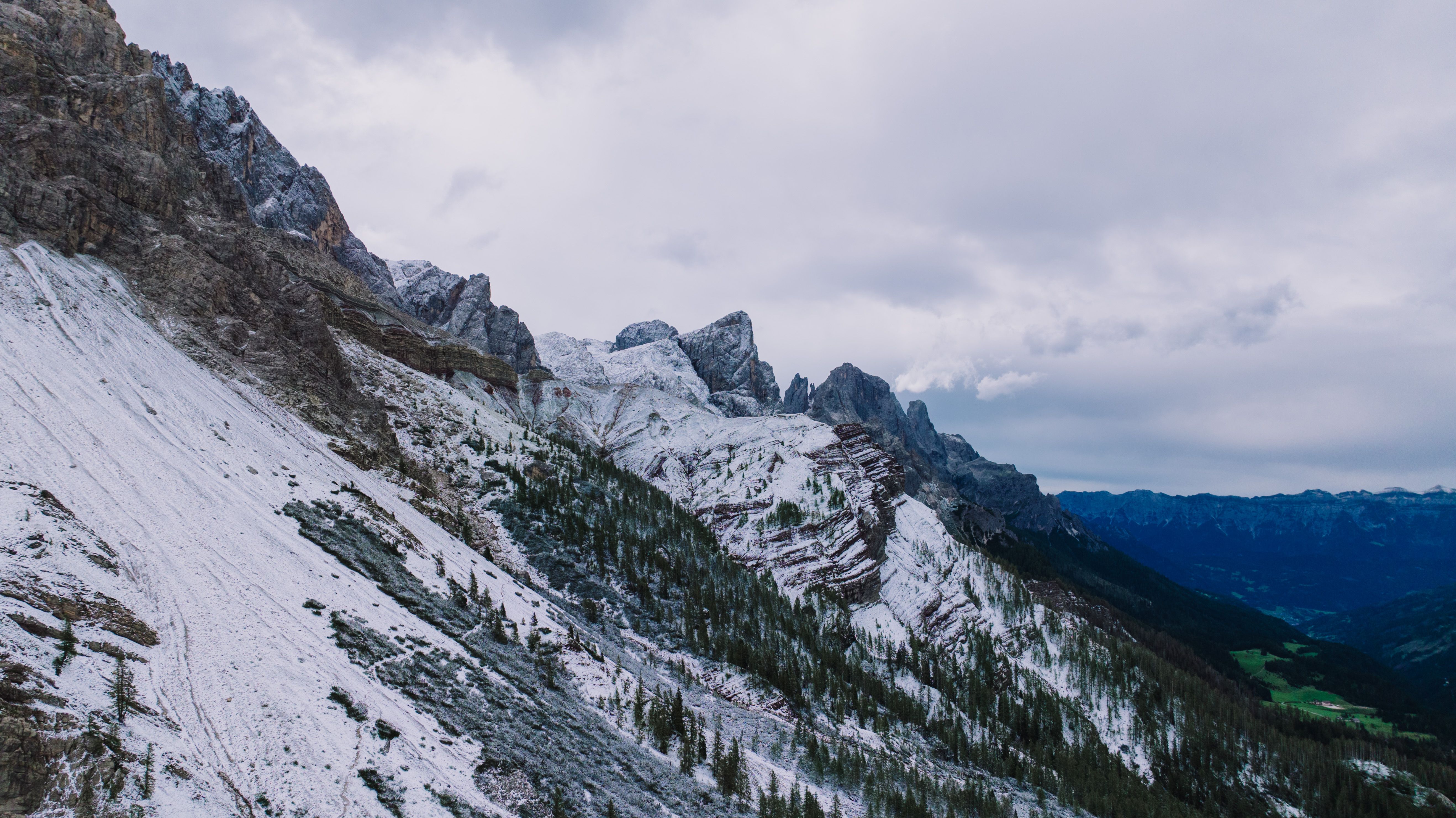 Breathtaking view of snow-covered mountains in the Dolomites, Italy, during winter.
