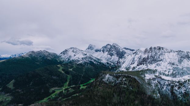 Aerial view of snow-covered mountains in San Martino di Castrozza, Italy.