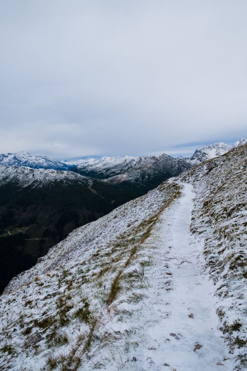 Free A scenic snowy mountain path in San Martino di Castrozza, Italy. Stock Photo
