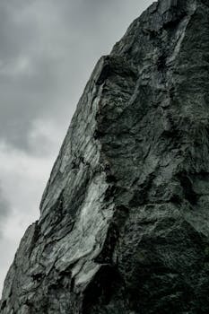 Close-up of a rugged rock formation set against a moody sky in Wrocław, Poland.