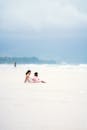 Mother and Child Relaxing on a Tranquil Beach