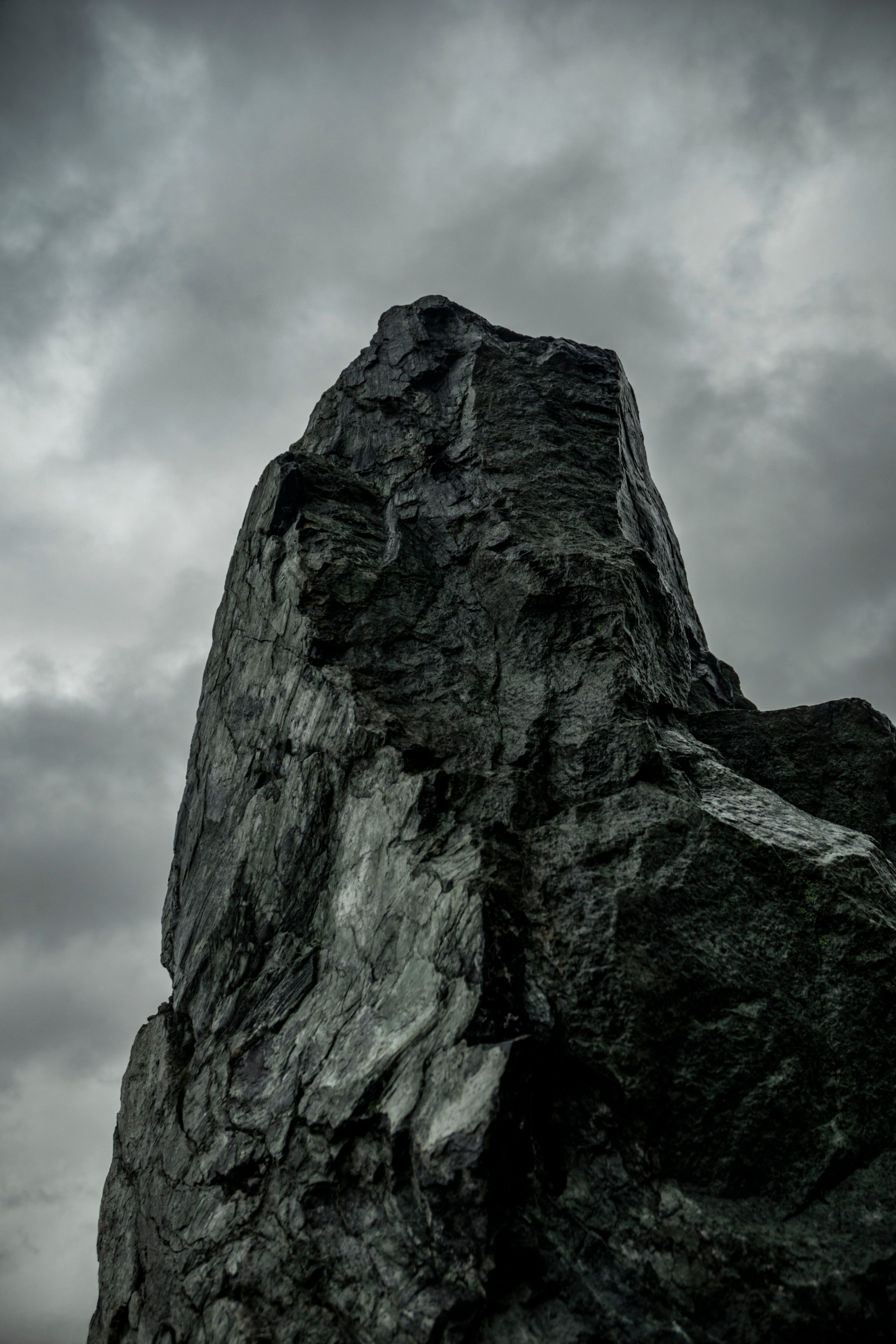 Dramatic Rock Formation Under Stormy Skies · Free Stock Photo