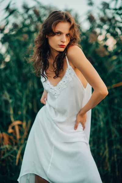 White slip dress photographed outdoors — photo by Konstantin Mishchenko on Pexels