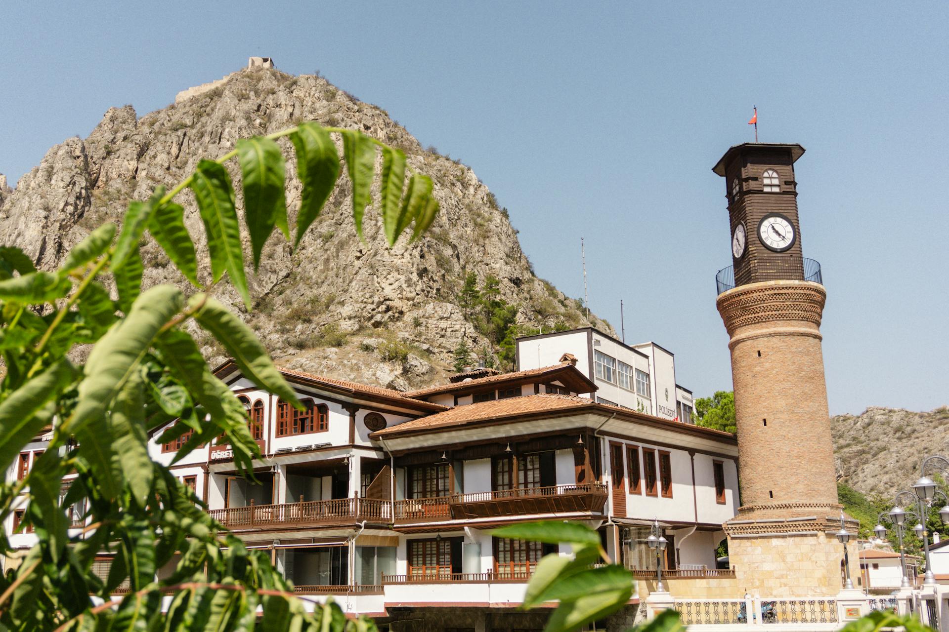 Scenic view of Amasya's renowned clock tower and traditional architecture set against a mountainous backdrop.