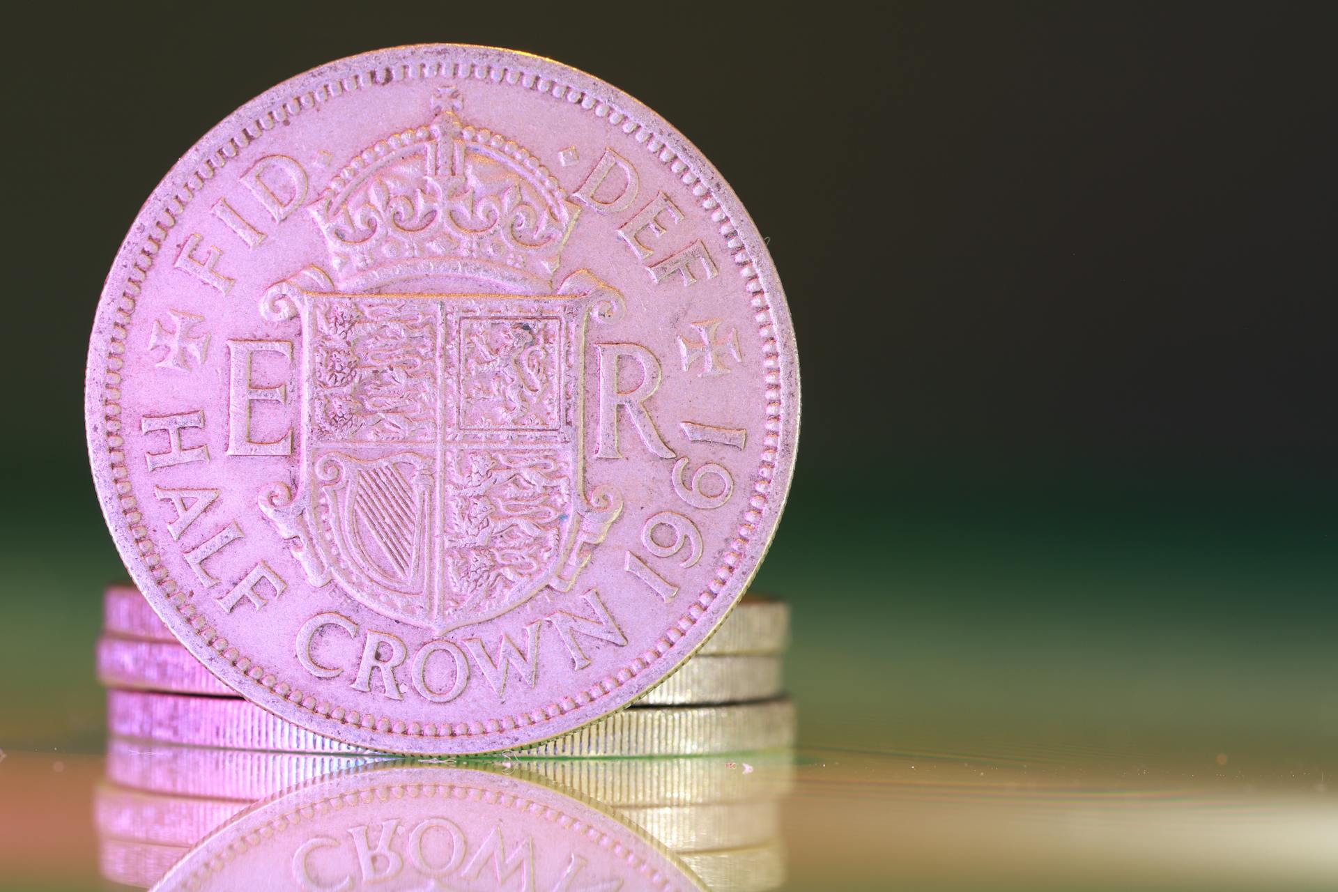 Detailed macro shot of a 1961 British half crown coin, showcasing historical design.