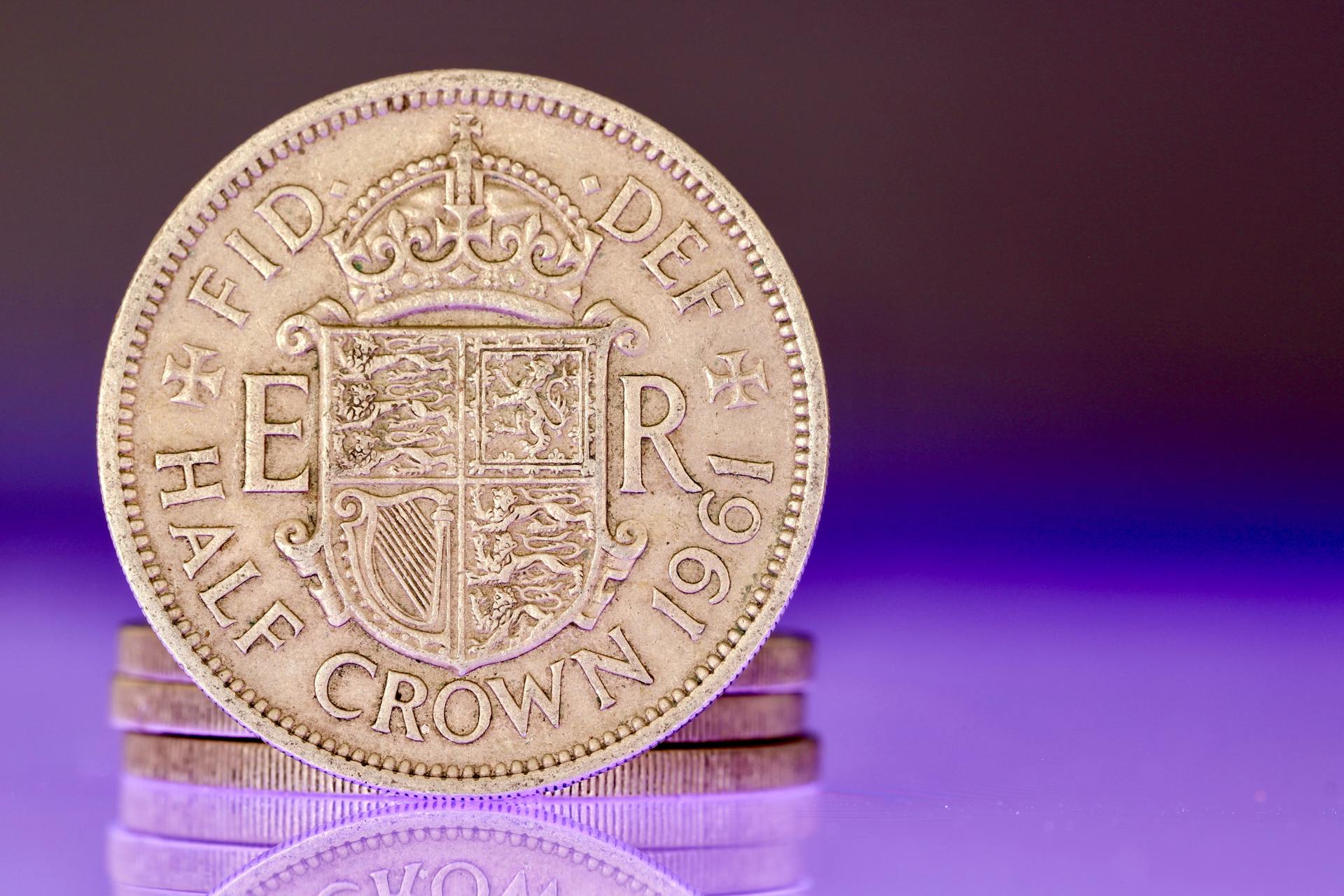 Detailed image of a 1961 British half crown coin, showing intricate design and historical elements.