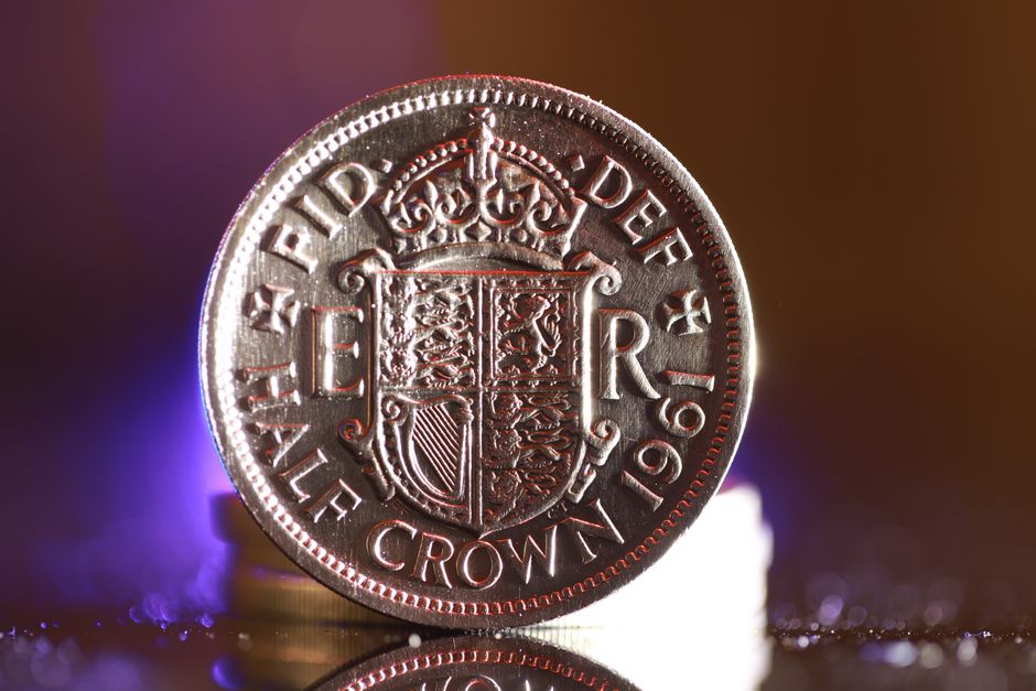 Photo by Nic Wood on Pexels Detailed image of a 1961 British half crown coin reflecting vivid light.
