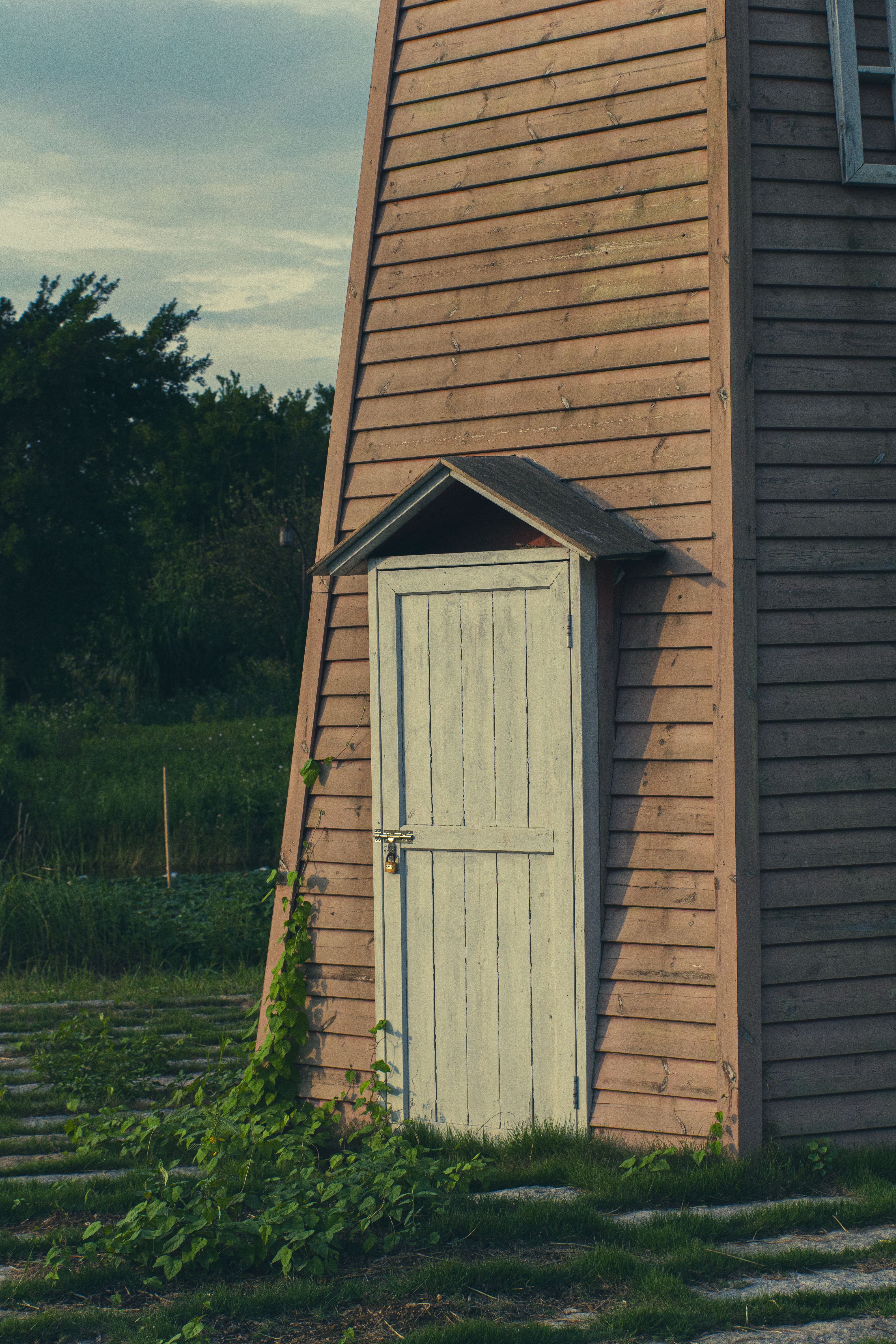 Rustic Wooden Shed in Tranquil Rural Setting · Free Stock Photo