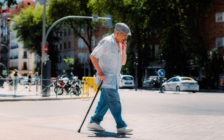 Official white taxi with red stripe in Madrid, Spain