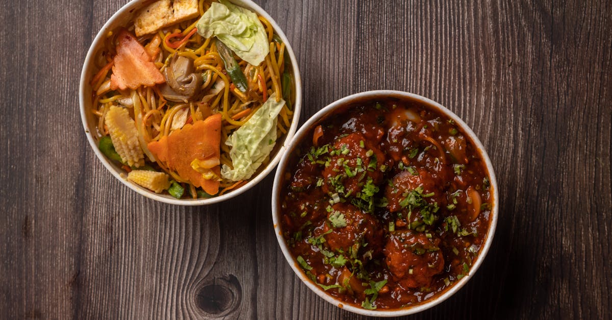 Indulge in a flavorful Indo-Chinese combo of vegetable noodles and spicy Manchurian for a delightful meal.