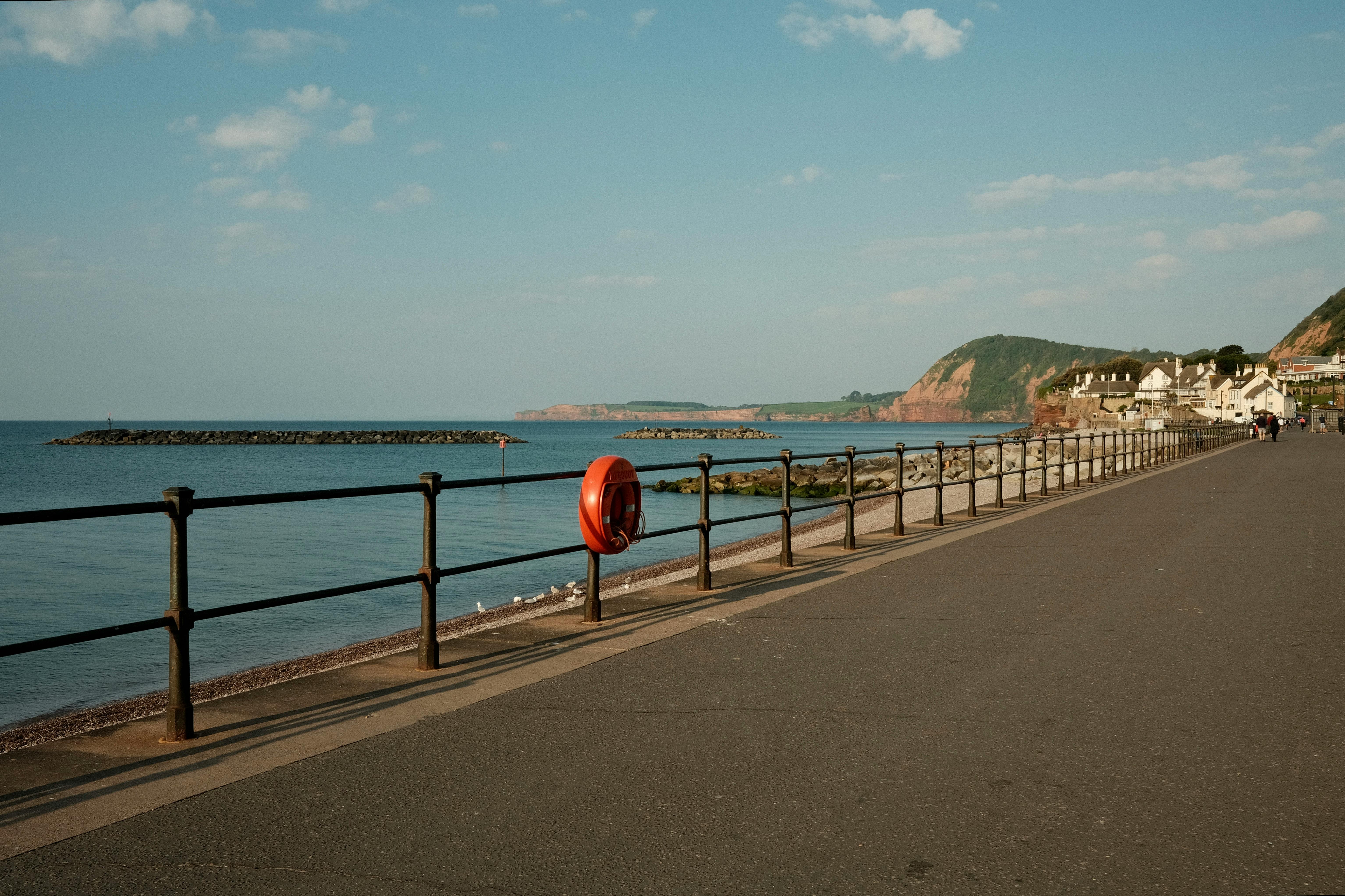 Tranquil Sidmouth beachfront promenade, showcasing peaceful ocean views and coastal charm.