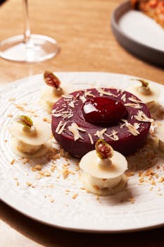 Beautifully plated gourmet dessert with berry and cream layers, ideal for culinary presentations.