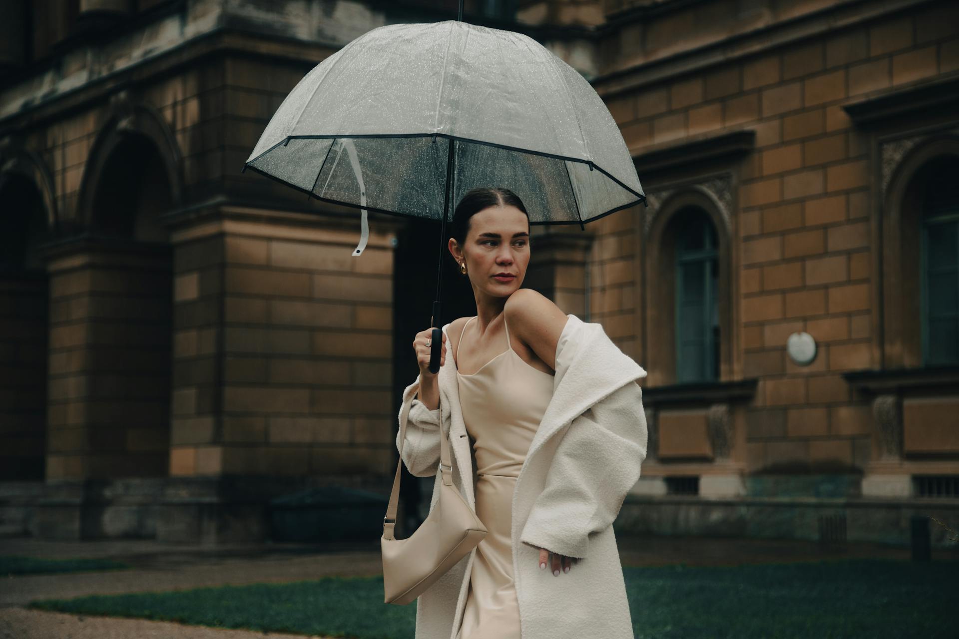 Stylish Woman with Umbrella in Rainy Munich