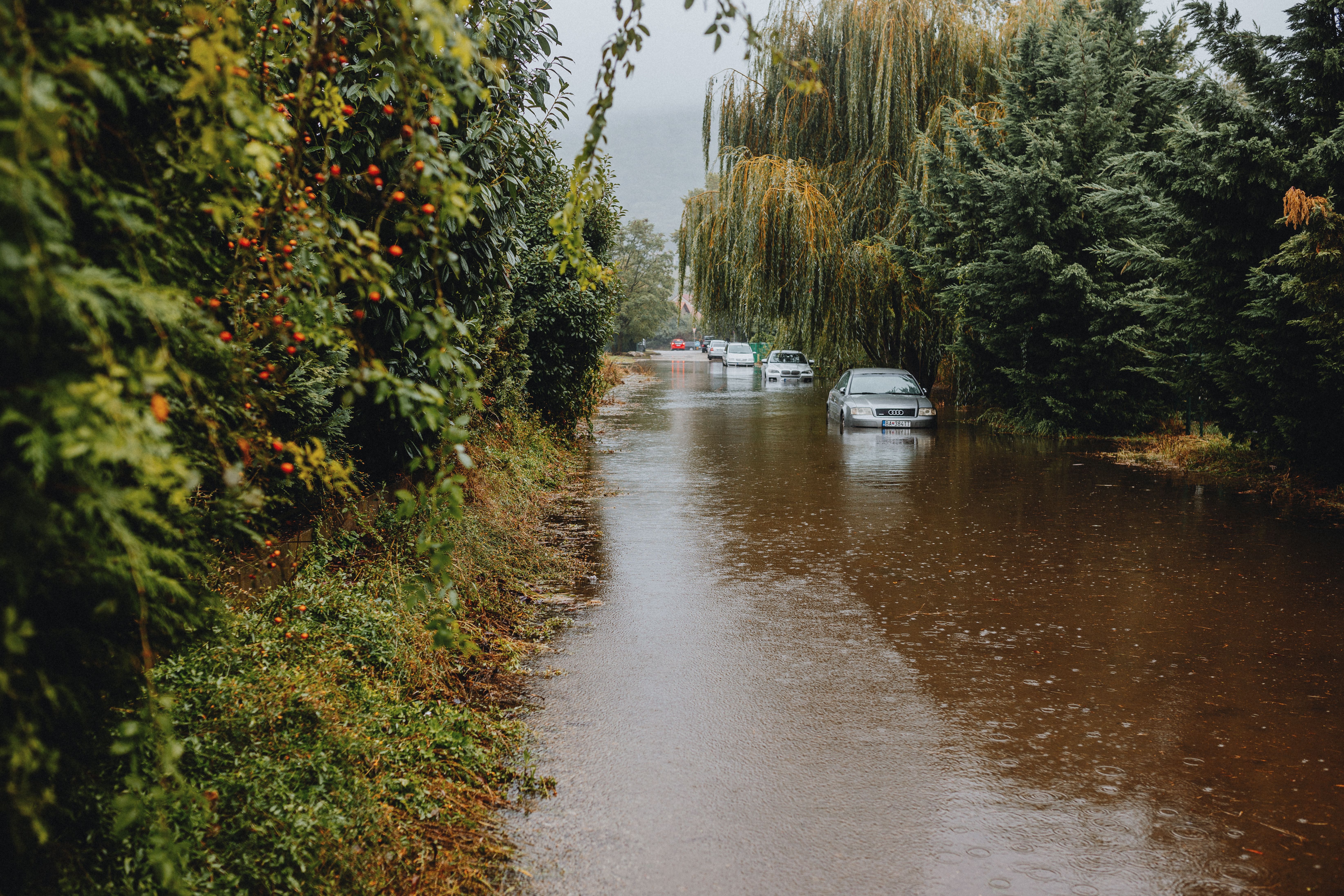 Urban Flooded Street with Submerged Car