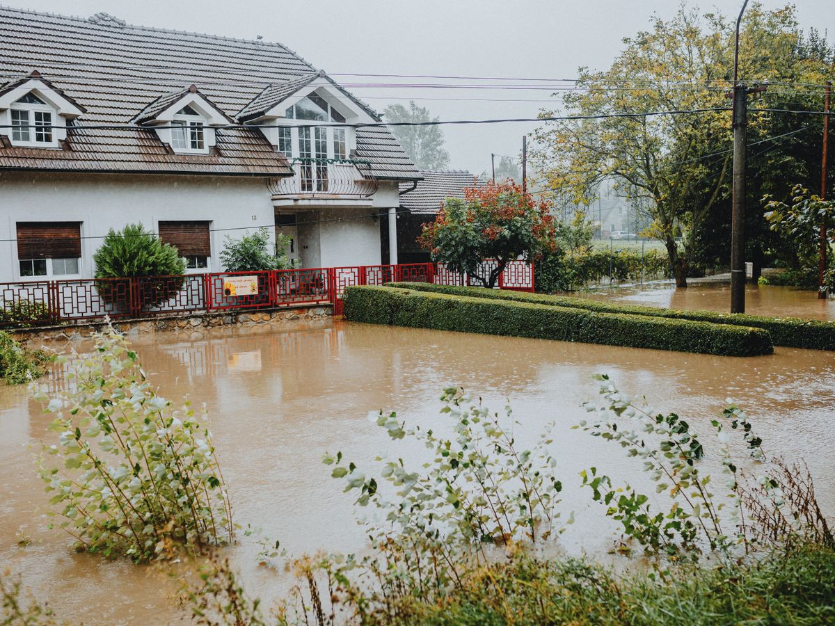 A suburban house surrounded by floodwaters after heavy rain