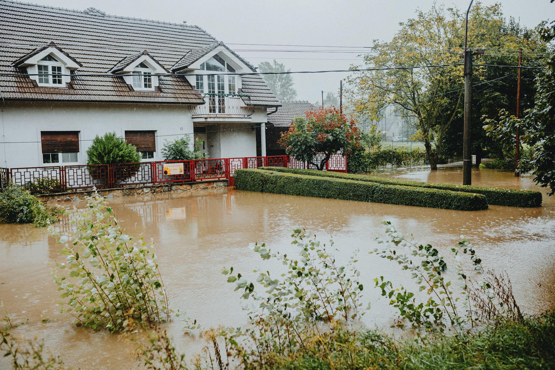 Flooded suburban house during heavy rain