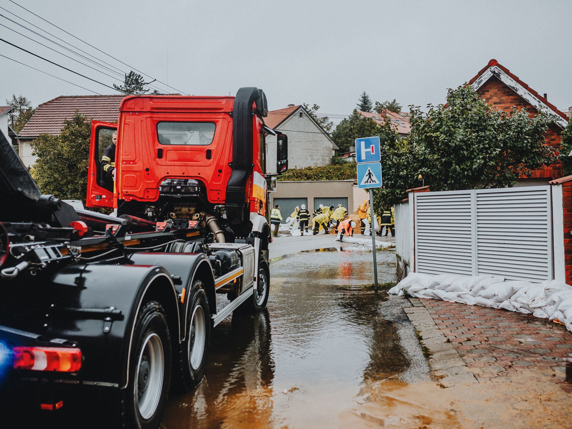 House Removals in Highworth, South West — removals crew carrying furniture out to the removal lorry
