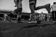Street Soccer Game with Kids Practicing Outdoors