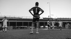 Urban Youth Soccer Game Under Bridge