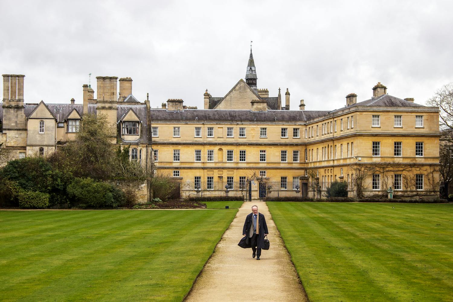 Scenic view of a historic building in Oxford with lush garden path