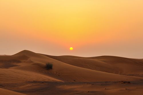 Free Stunning view of golden sand dunes and sunset in Dubai desert. Stock Photo