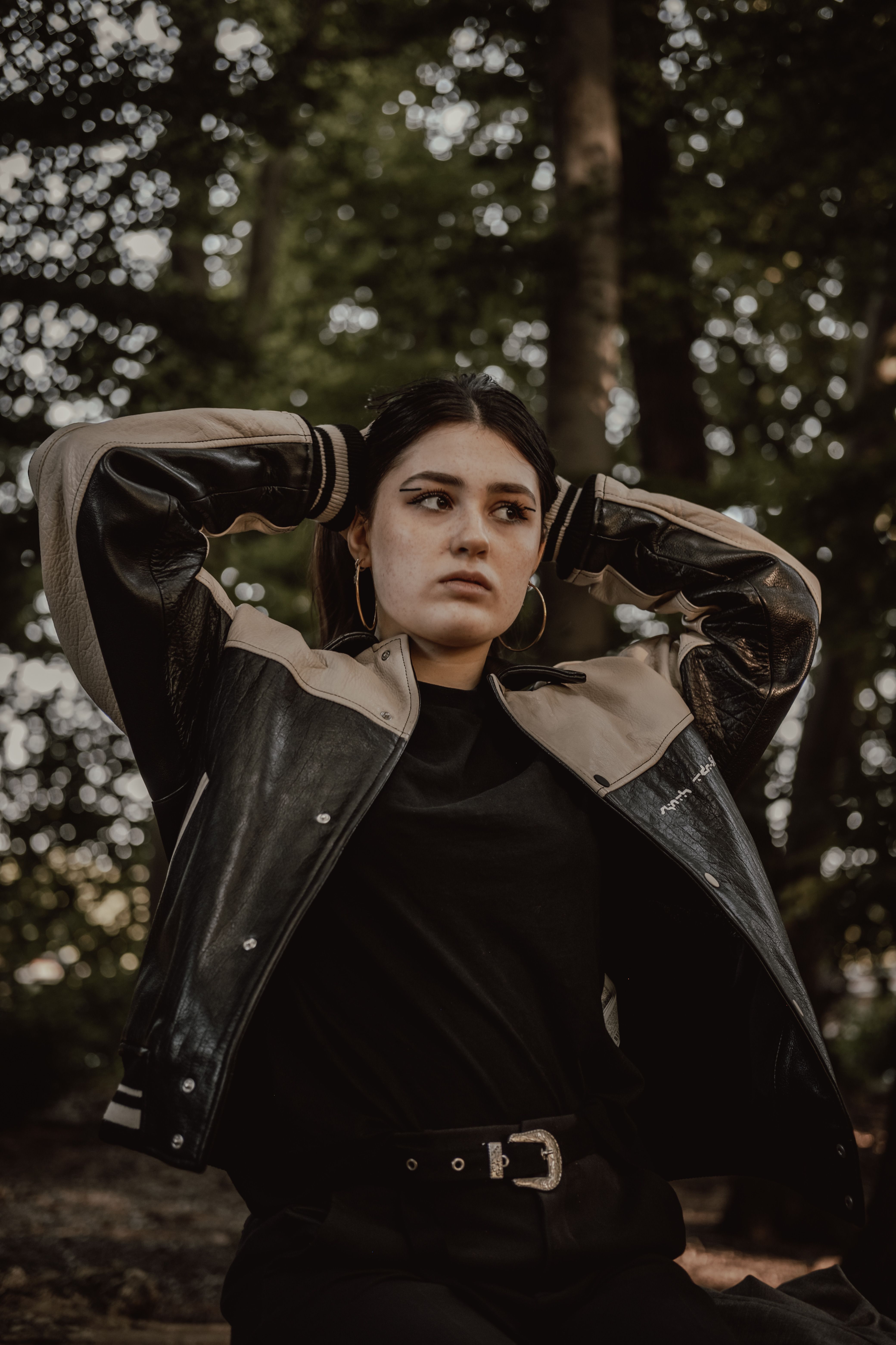 Woman in Leather Jacket Posing Outdoors · Free Stock Photo