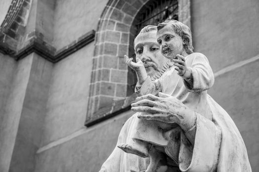Black and white photo of a Saint Joseph and Child Jesus sculpture in Mexico City.