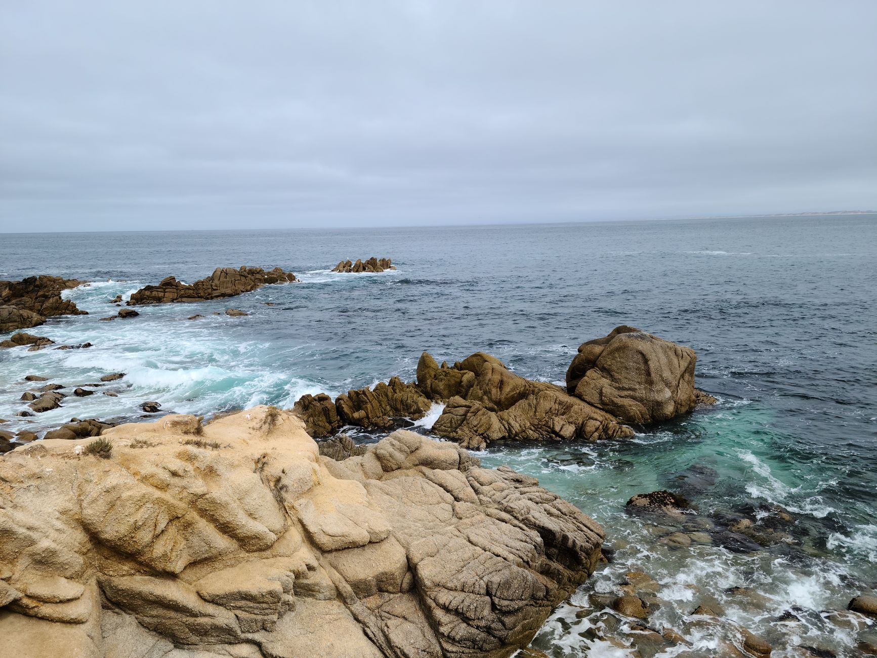 Monterey Bay coastline at dawn — the light that verifies our work