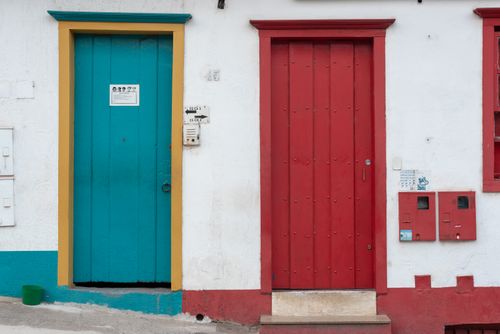 Free Vibrant red and blue doors in the historic streets of Sabará, Brazil. Stock Photo