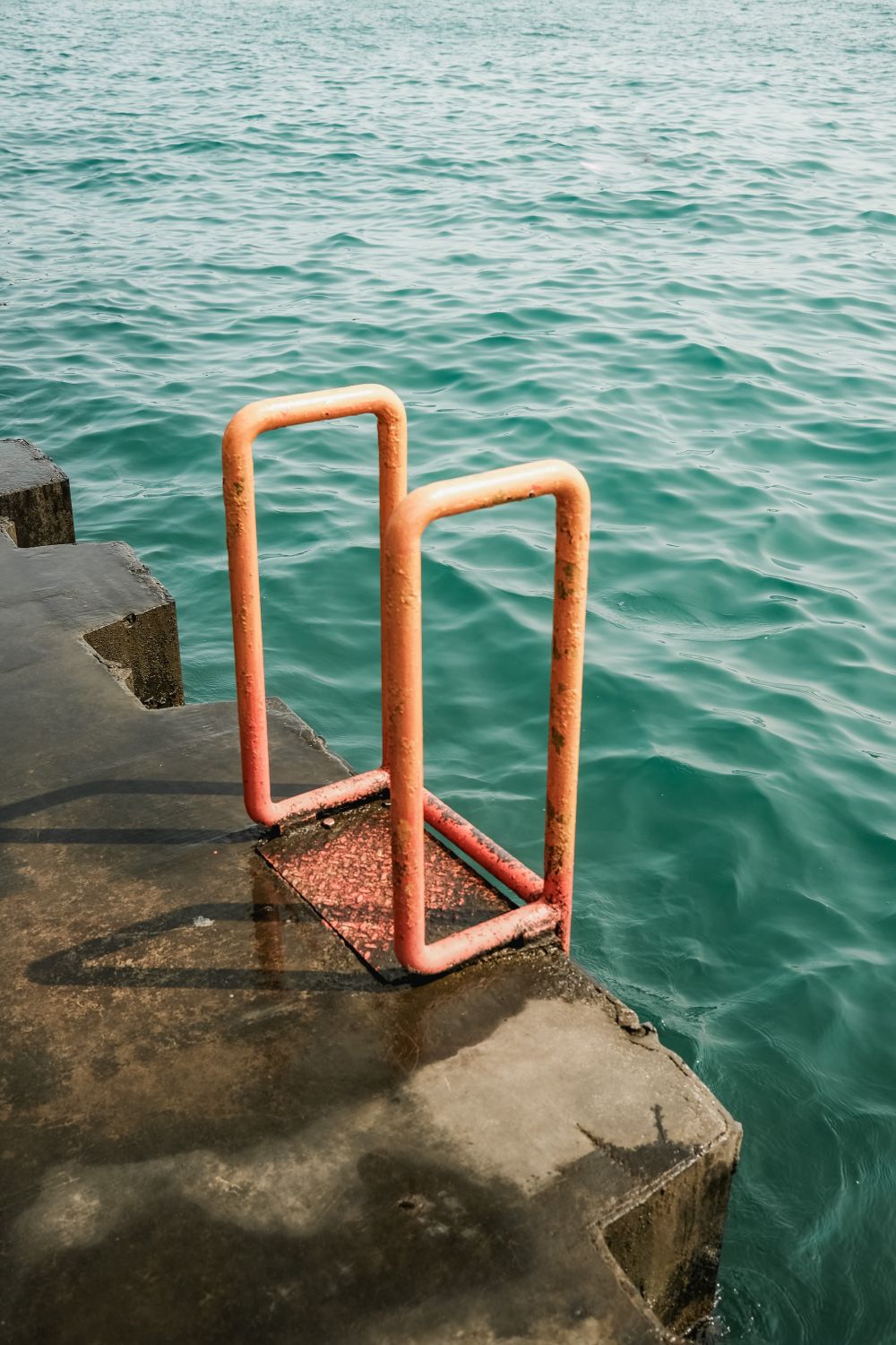 Rusty Metal Ladder by the Turquoise Ocean · Free Stock Photo