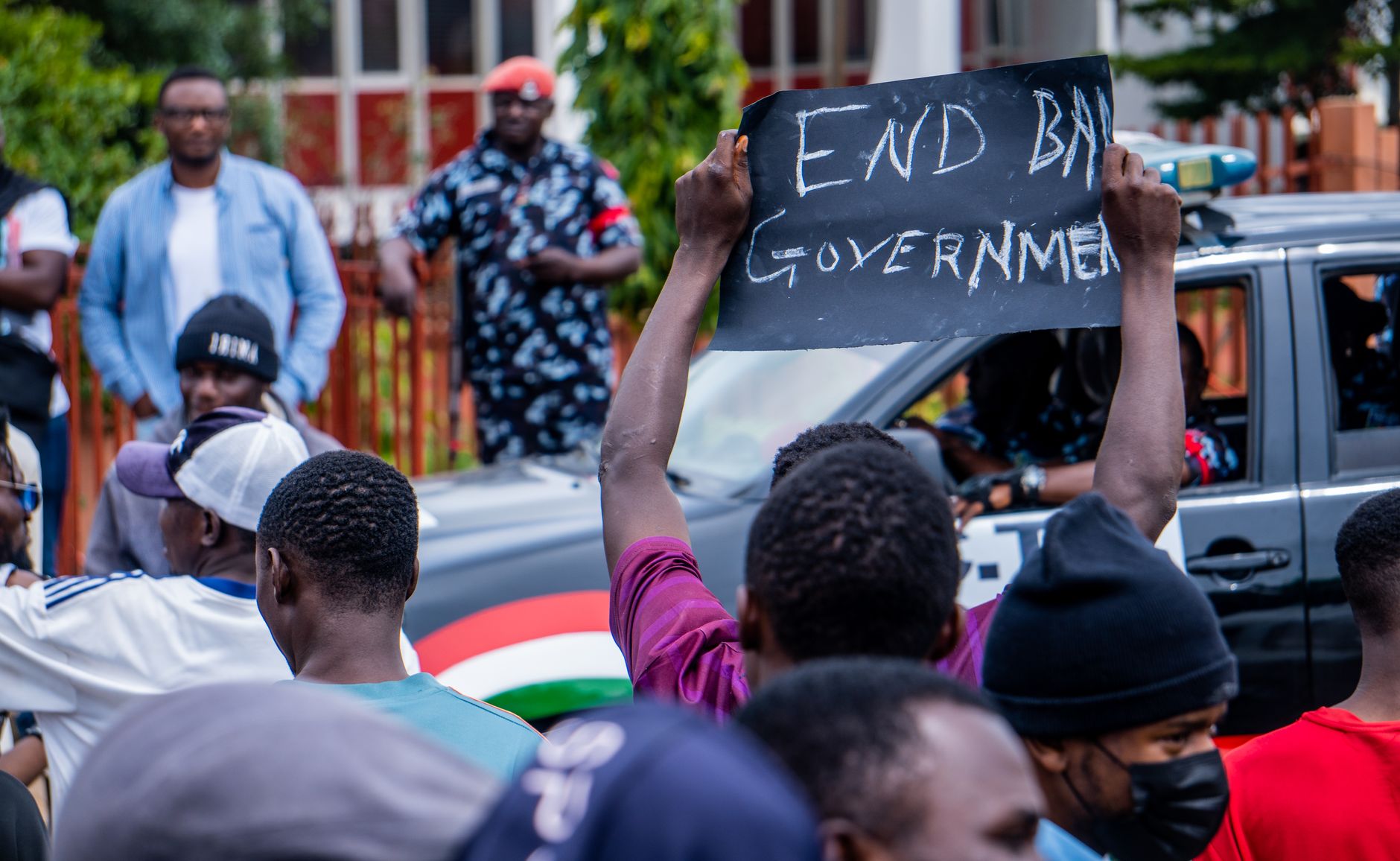 Demonstrators in Nigeria express political discontent with an 'End Bad Government' sign.