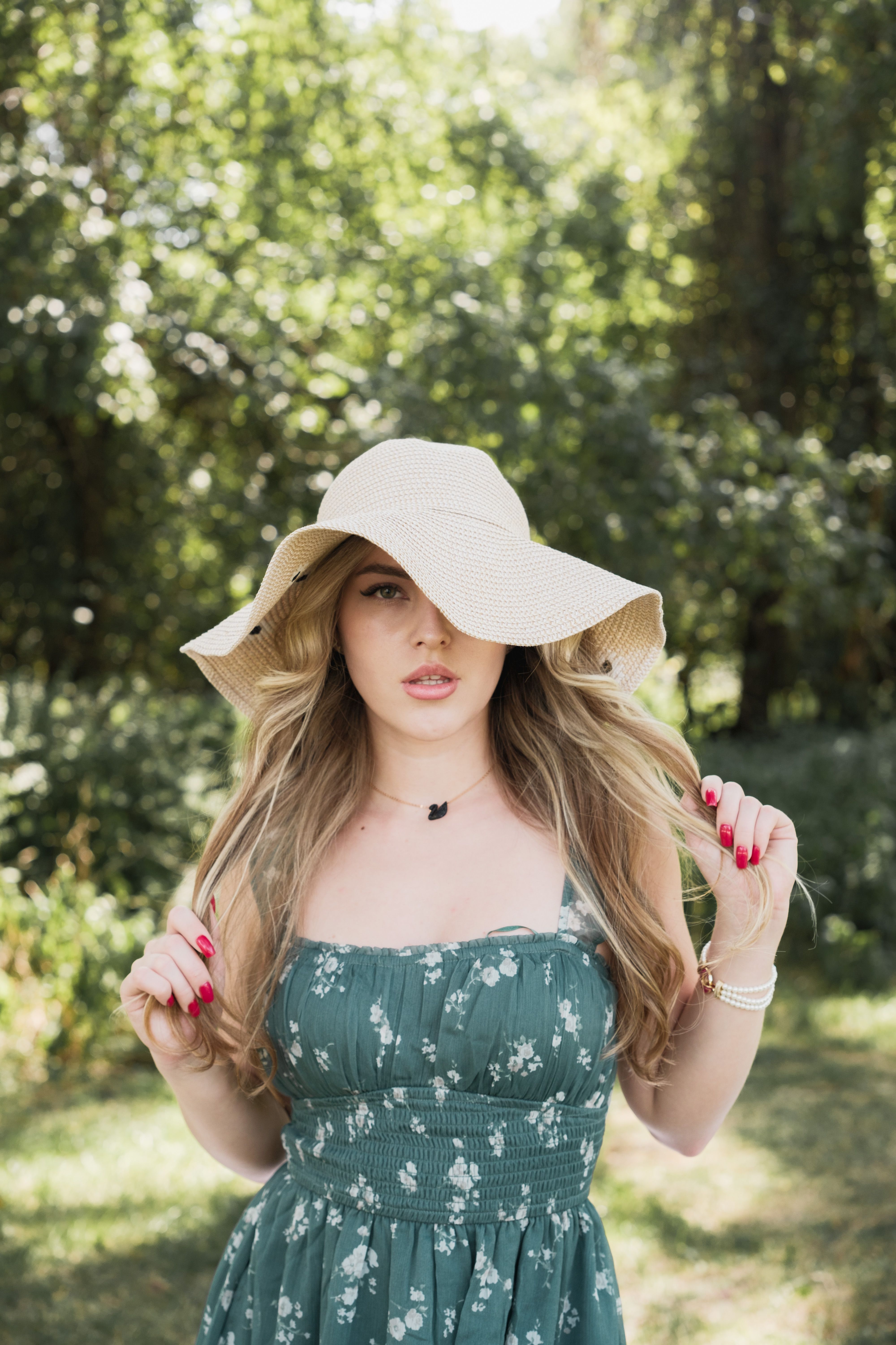 Elegant Woman in Sun Hat in Summer Park · Free Stock Photo — free download