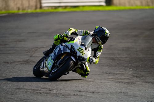 Free Dynamic image of a motorcyclist racing on a track in Batangas, Philippines. High-speed action captured outdoors. Stock Photo