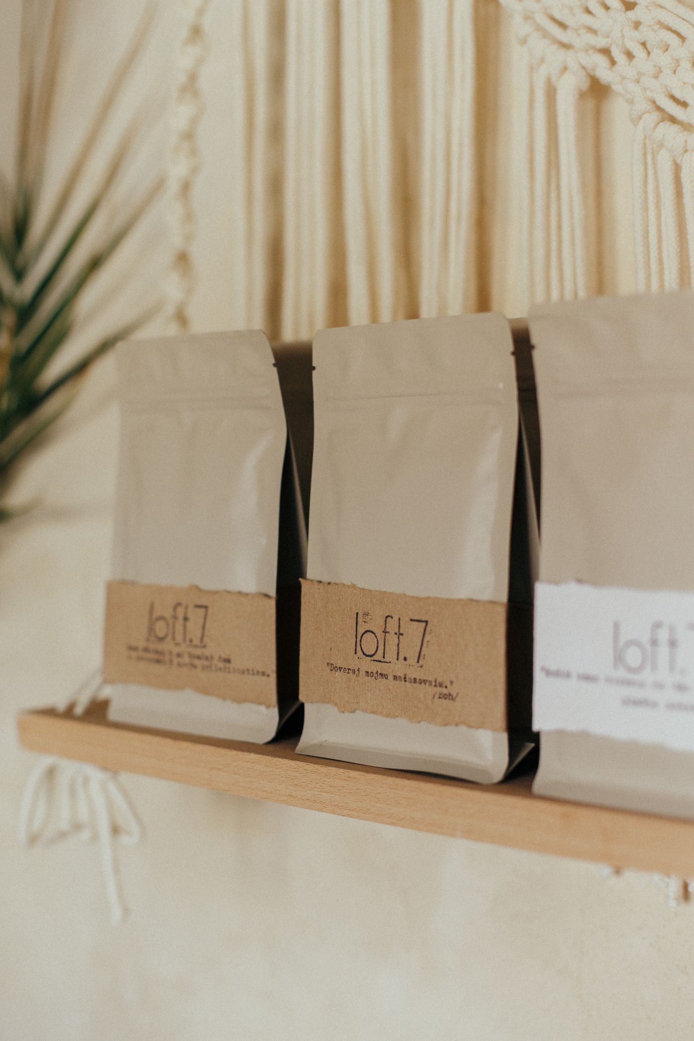 Specialty coffee bags on a wooden shelf