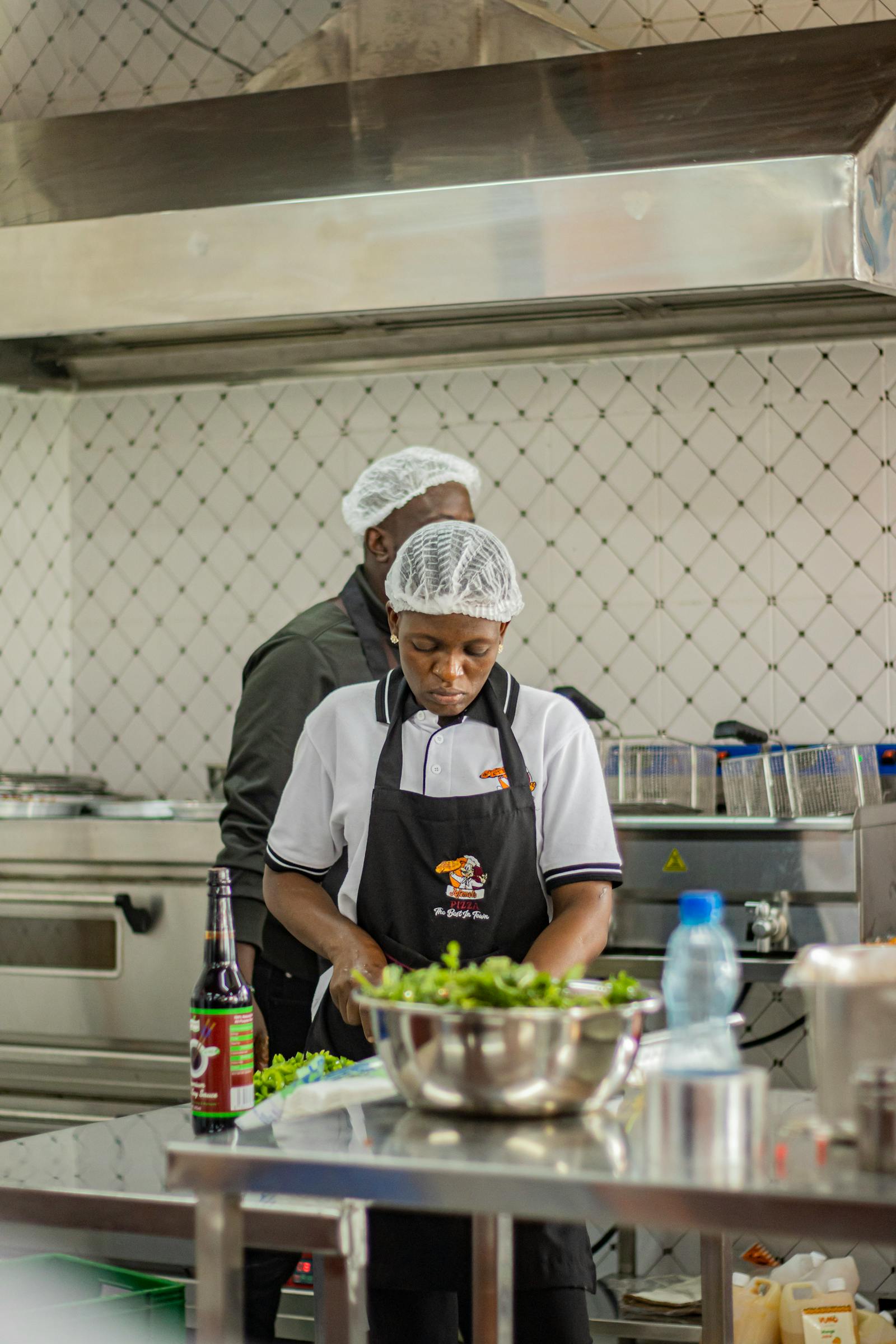 African food production team working in a commercial kitchen