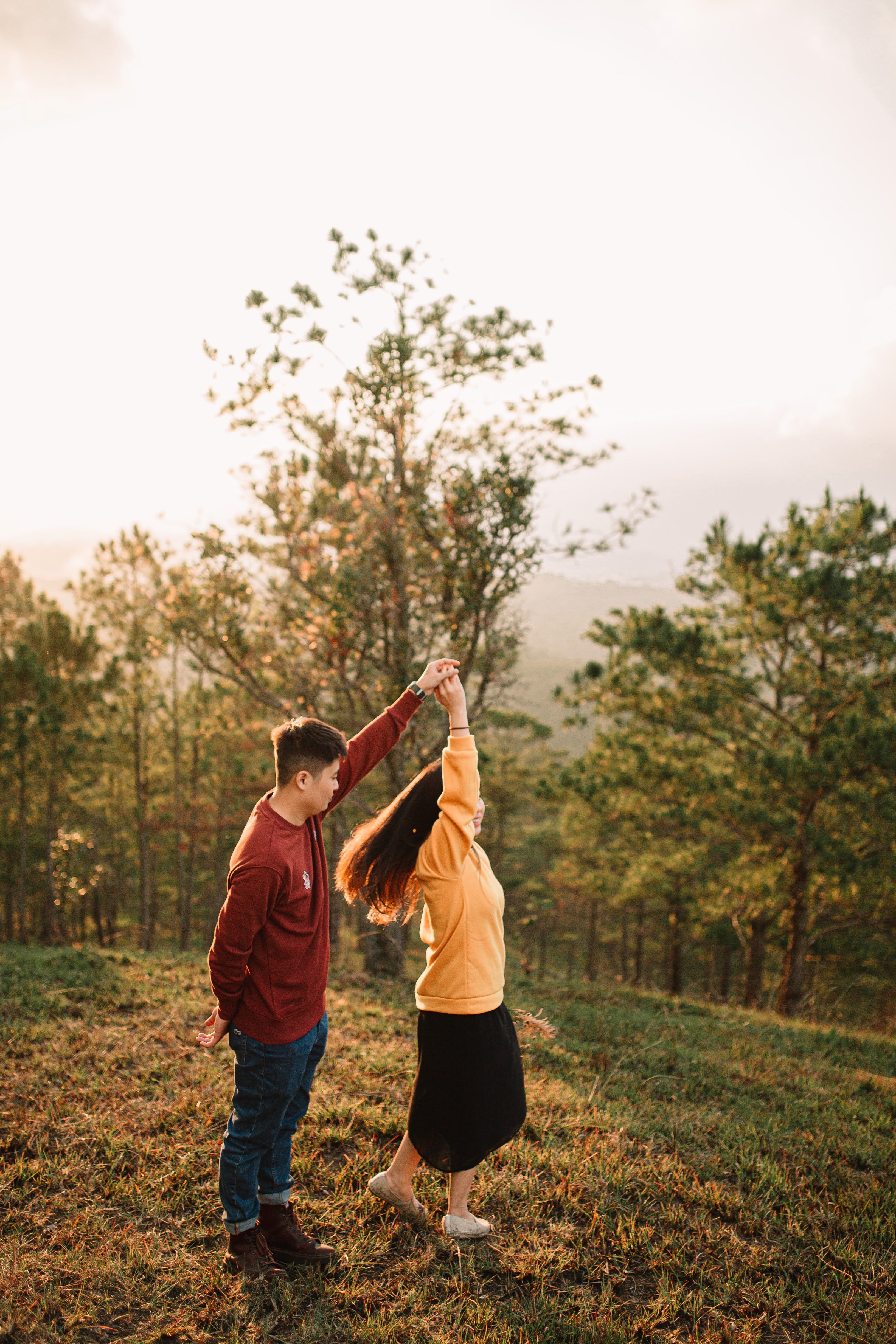 Couple Dancing in Nature During Golden Hour · Free Stock Photo