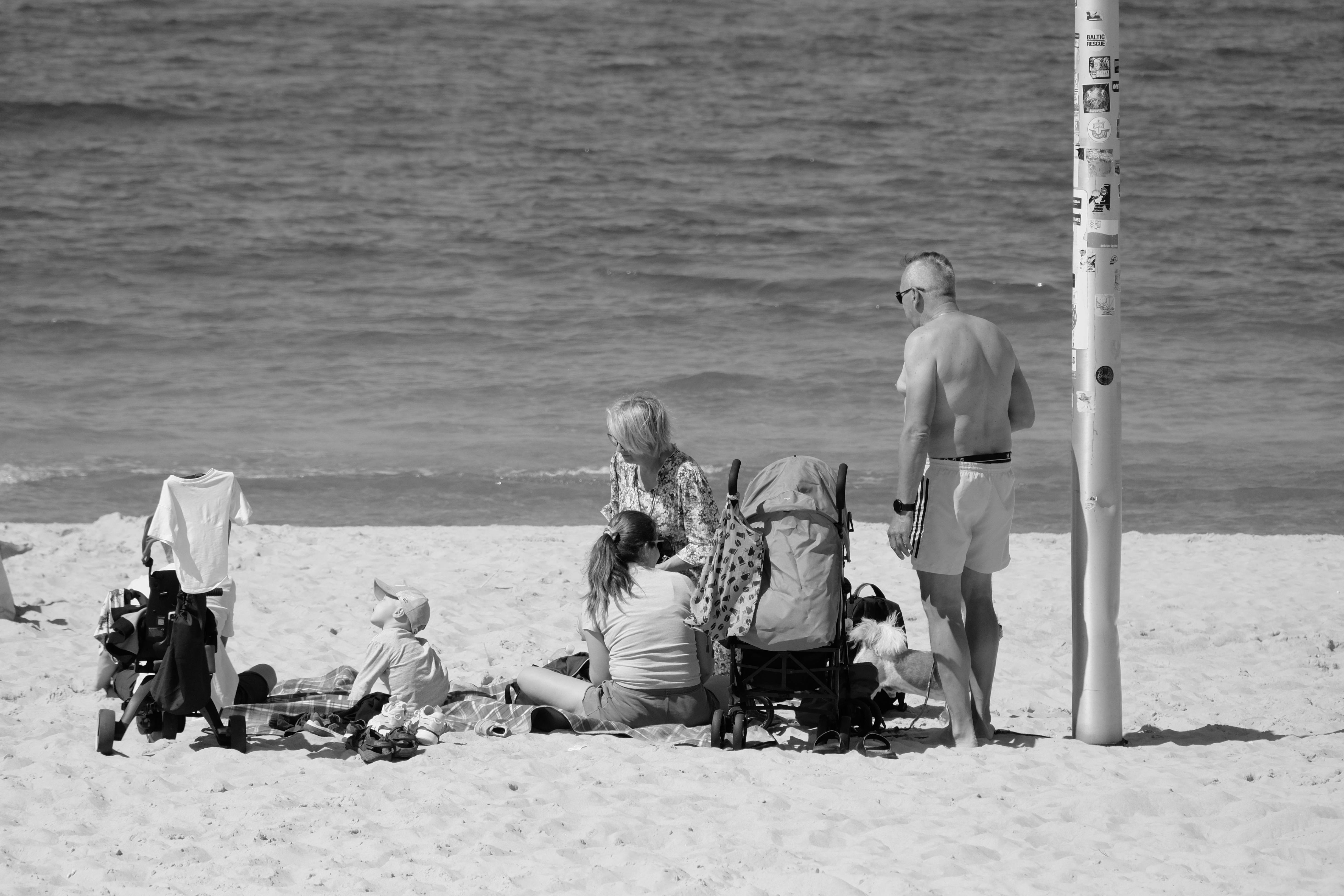Family at the beach with baby buggy