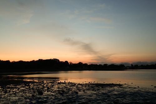Free Tranquil view of Cove Island Park shoreline during a stunning sunset in Stamford, CT. Stock Photo