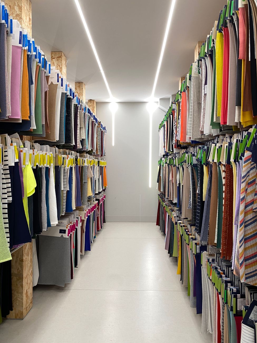 Rolled performance textiles stacked in a materials aisle