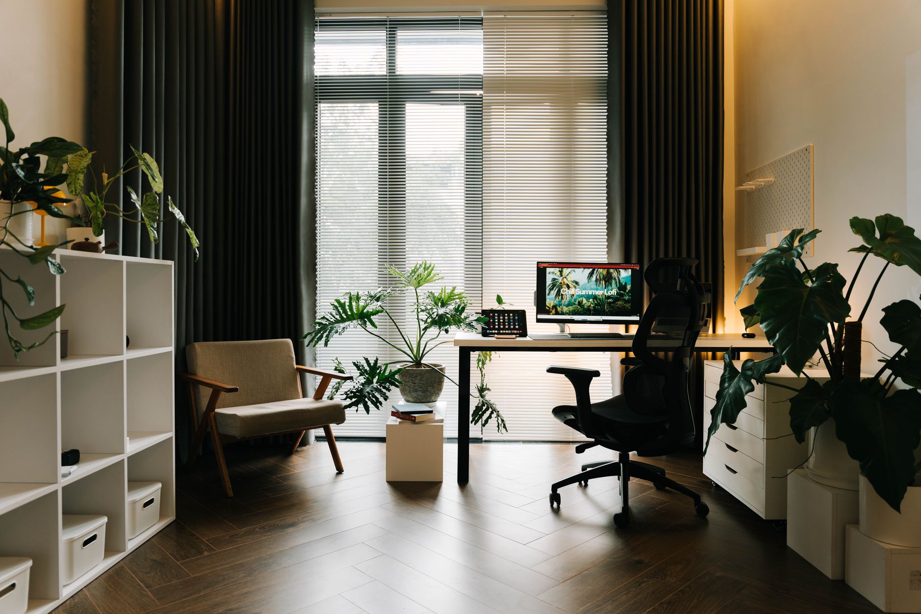 cozy home office renovation for modern homes A stylish home office with modern furniture and lush greenery.
