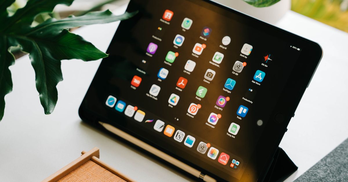 Tablet Workspace Layouts Modern Workspace with Tablet and Plants · Free Stock Photo