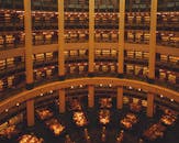 Grand library interior with warm lighting