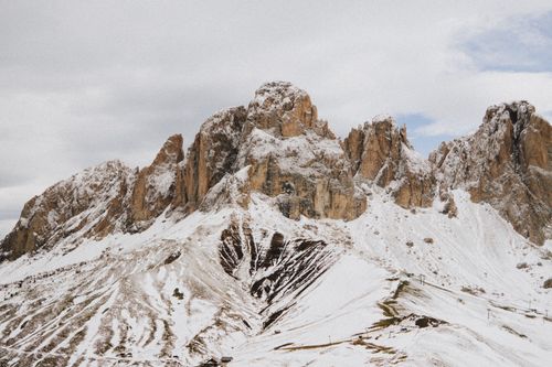 Free A breathtaking view of snow-covered peaks in the Dolomites, Canazei, Italy. Stock Photo